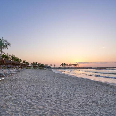 منتجع صلالة روتانا المظهر الخارجي الصورة Sunset at the beach